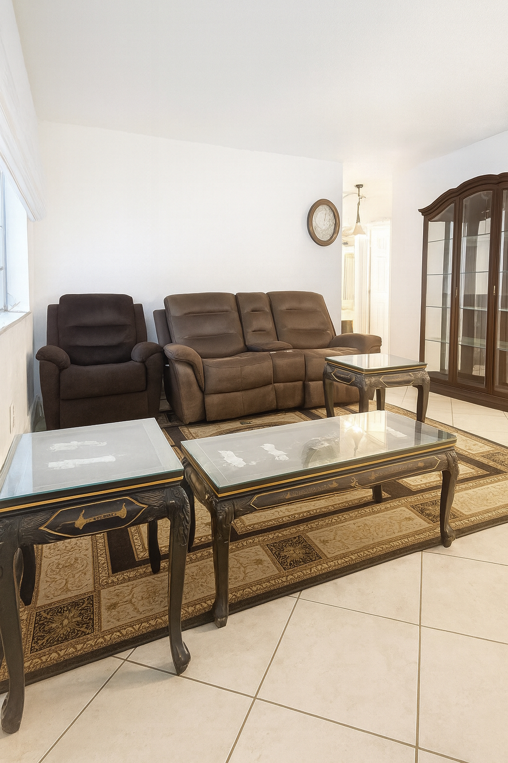 Living room with tile floors and backyard access